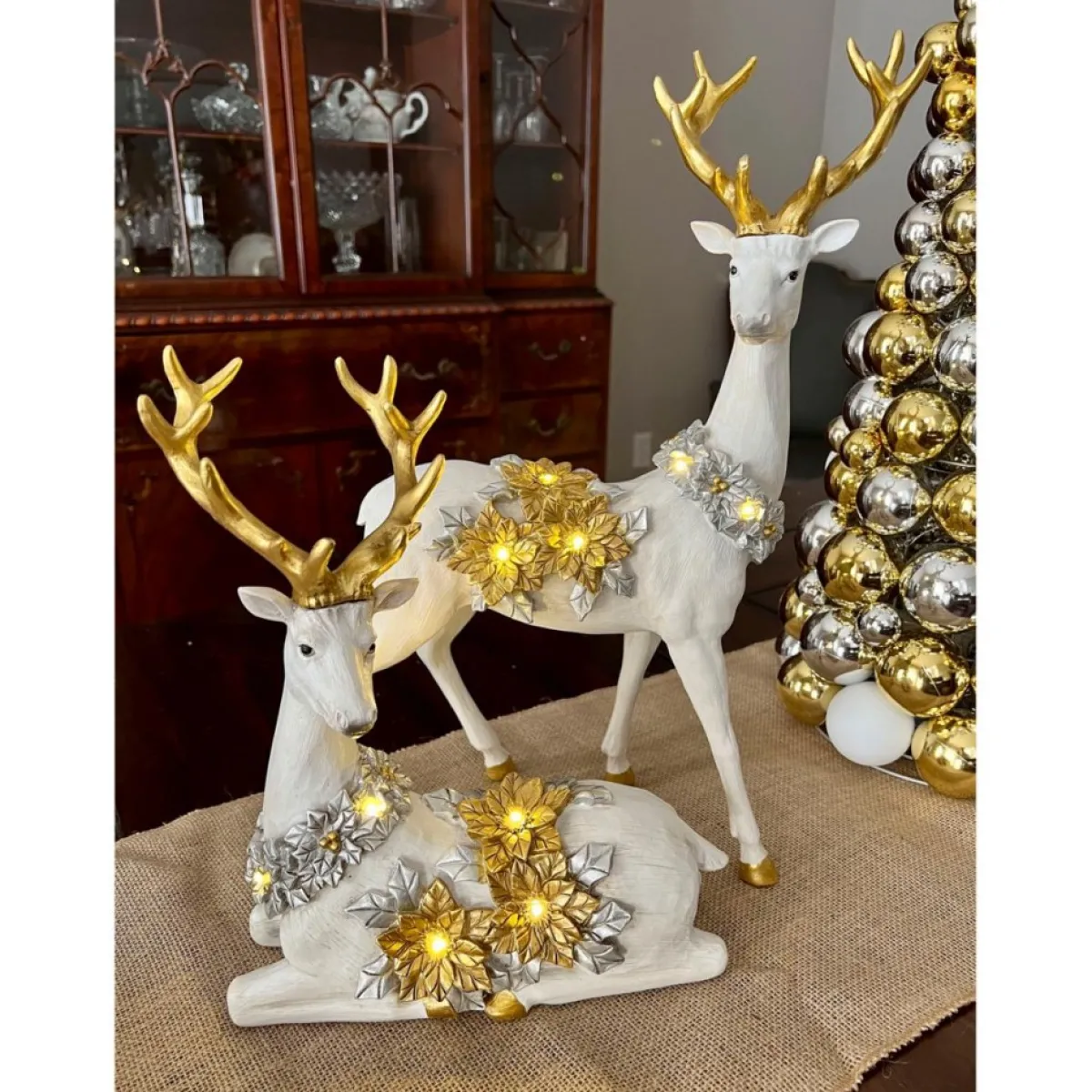 winter_lane_piece_illuminated_reindeer_with_poinsettias_2.webp Winter Lane Indoor Decor | 2-Piece Illuminated Reindeer With Poinsettias